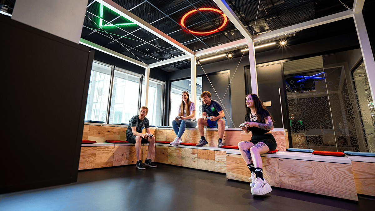 Sony Interactive employees playing games in a office